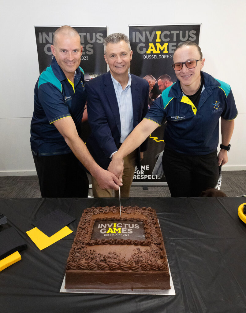 Flight Sergeant Nathan King (left), Assistant Minister for Defence, Assistant Minister for Veterans Affairs, Assistant Minister for the Republic, The Honourable Matt Thistlethwaite MP and Able Seaman Taryn Dickens cut the official Invictus Games 2023 cake during the announcement of the co-captains at the Sydney Academy of Sports and Recreation, Narabeen, Sydney. *** Local Caption *** Flight Sergeant Nathan King and Able Seaman Taryn Dickens have been announced as the co-captains of Team Australia for Invictus Games Dusseldorf 2023. The sixth Invictus Games will be held from 9-16 September 2023, in Dusseldorf Germany. The Australian Defence Force and Invictus Australia have partnered to support 31 Australian competitors and their family and friends. The Invictus Games is an international adaptive sporting event for serving and former serving military personnel who have been wounded, injured or become ill during their military service. Up to five hundred competitors from 22 nations will compete in 10 adaptive sports. The Games use the healing power of sport to inspire recovery, support rehabilitation and celebrate the crucial role played by family and friends.