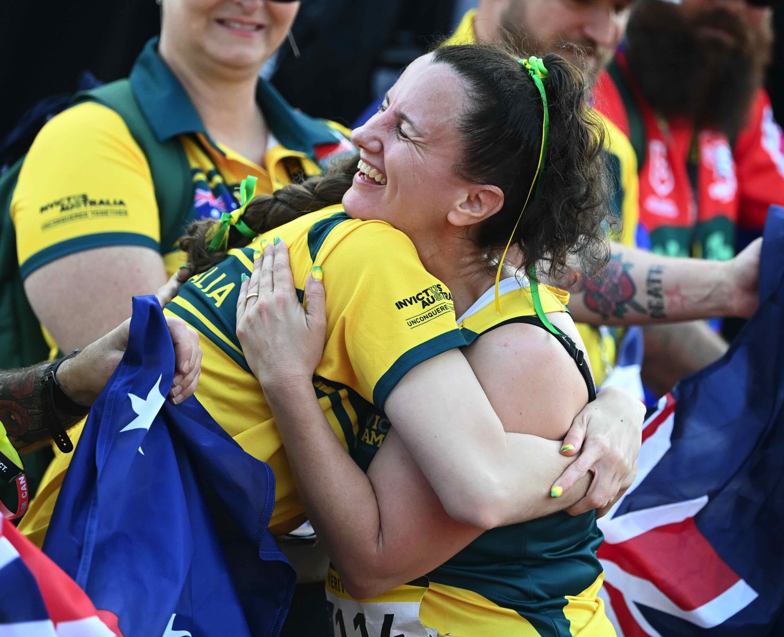 Verity Sanchez is embraced by family at the athletics at Invictus Games Dusseldorf 2023