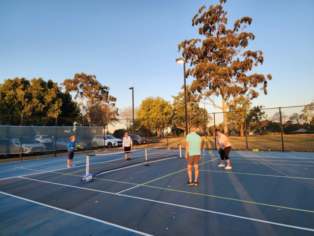 participants and people volunteering at an Invictus Australia pickleball event