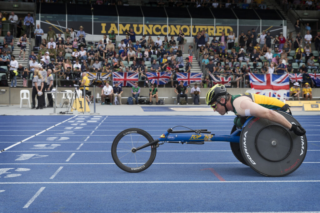 Matt Brumby, Invictus Games alumni, crosses the finish line at the Invictus Games Sydney 2018